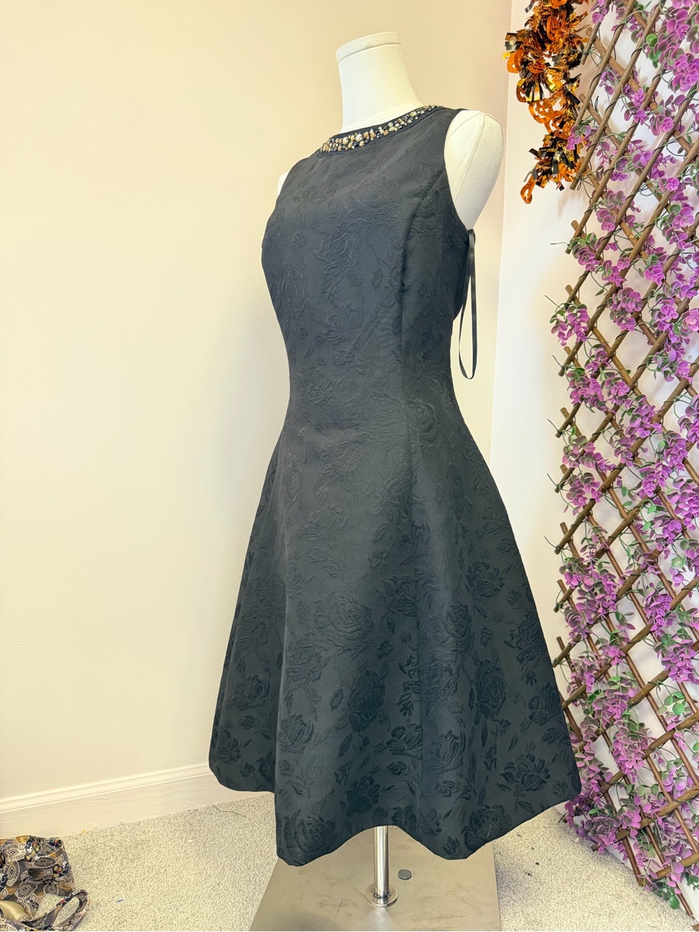 Elegant Black Sleeveless A-Line Fit and Flare Dress with Beaded Neckline